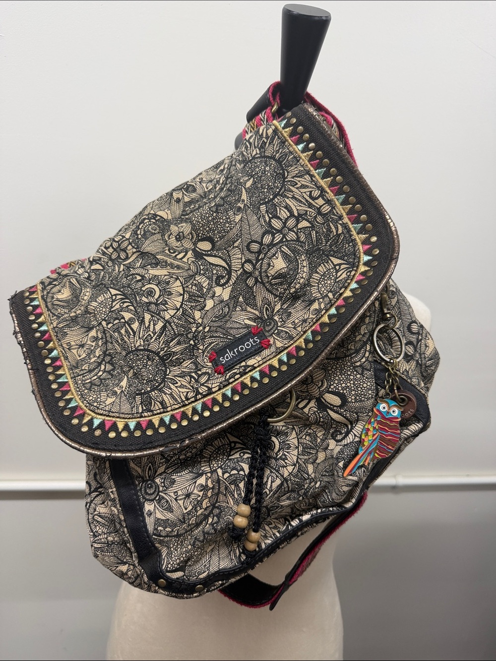 Sakroots Beige Floral Canvas Flap Backpack with Multicolor Trim and Owl Charm